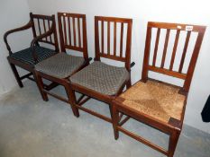 An elbow chair and 3 dining chairs