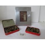 A hammered pewter photo frame and 2 small tins of military buttons