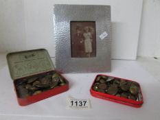 A hammered pewter photo frame and 2 small tins of military buttons