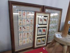 2 framed and glazed sets of football related cigarette cards and a framed and glazed set of flags