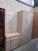 A 1930's limed oak wardrobe and chest of drawers