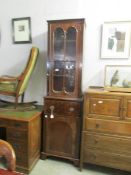 A tall 19th century mahogany cabinet