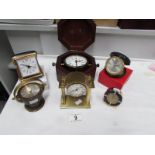 4 Swiza clocks including boxed Bulova ship's gimbal clock and a travel clock