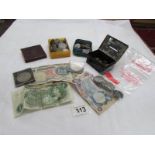 A mixed lot of UK and foreign coins and bank notes