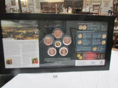 A framed and glazed Battle of Waterloo bicentenary coin collection including gold coin