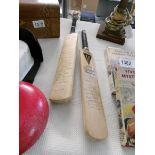 2 small signed cricket bats with multiple signatures