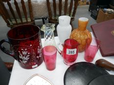 A mixed lot of coloured glass including large hand painted ruby glass decanter, cramberry glass,