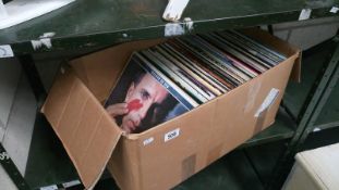 A box of approximately 100 LP records