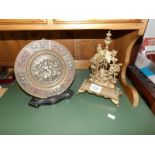 An oriental brass plaque and one other