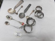 A quantity of collector's spoons and 6 white metal napkin rings