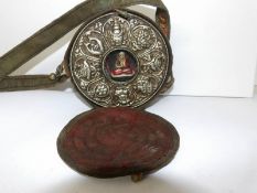 An oriental prayer item in fabric carry case