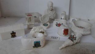 13 items of Goss crested china including a bust, a sedan chair, Whitby ammonite,