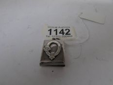 A silver photo locket