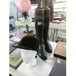 A pair of riding boots with boot trees and a Harry Hall riding hat (head not included)