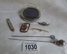 A mixed lot including gold fox head bar brooch, silver photo frame, silver pen knife, silver brooch,