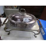 A silver plated breakfast serving dish with burner