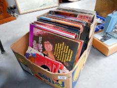 A box of LP records including boxed sets