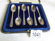 A cased set of 6 silver teaspoons, hall marked London and in W Mansel, Lincoln case,