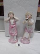 A pair of 19th century bisque figurines