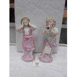 A pair of 19th century bisque figurines