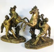 A pair of Victorian brass Marley horses