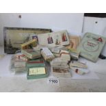 A large collection of assorted cigarette cards including sets