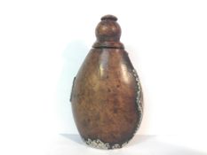 A circa 17/18th century burlwood snuff bottle with silver casing (parts missing) bearing the