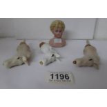 3 porcelain horse head bottle stoppers and a pin cushion doll head