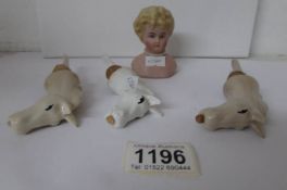 3 porcelain horse head bottle stoppers and a pin cushion doll head