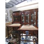 A pair of oak hall chairs with spindle backs