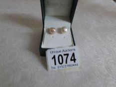 A pair of cultured pearl earrings