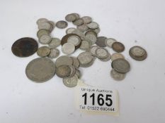 A mixed lot of UK coins including some pre 1947 silver