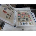 An album of world stamps including sheets,