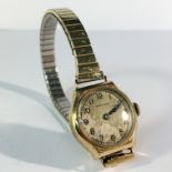 A vintage gold cased wrist watch,