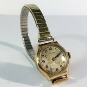 A vintage gold cased wrist watch,