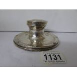 A silver inkwell hallmarked for Birmingham remaining marks rubbed,