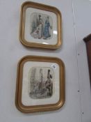 A pair of framed and glazed fashion prints