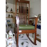 A slat back rocking chair