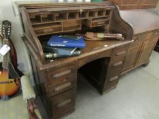 An oak roll top desk