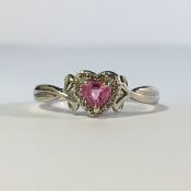 A 9ct white gold ring set with heart shaped stones