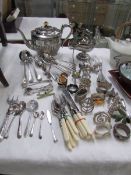 A mixed lot of silver plate including teapot, sugar scuttle,