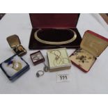 A mixed lot of costume jewellery including bracelets, cuff links,