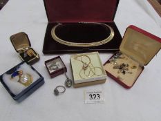 A mixed lot of costume jewellery including bracelets, cuff links,