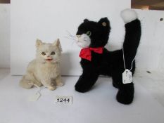A Steiff cat and an antique plush cat