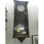 A mahogany single weight Vienna wall clock