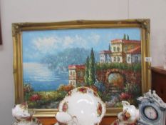 A gilt framed oil on canvas continental scene