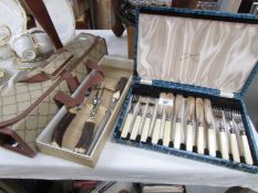 A cased set of fish knives and forks,