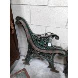 A pair of ornate cast iron bench ends