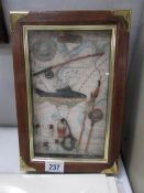 A framed and glazed angling collage