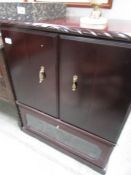 A mahogany Television cabinet